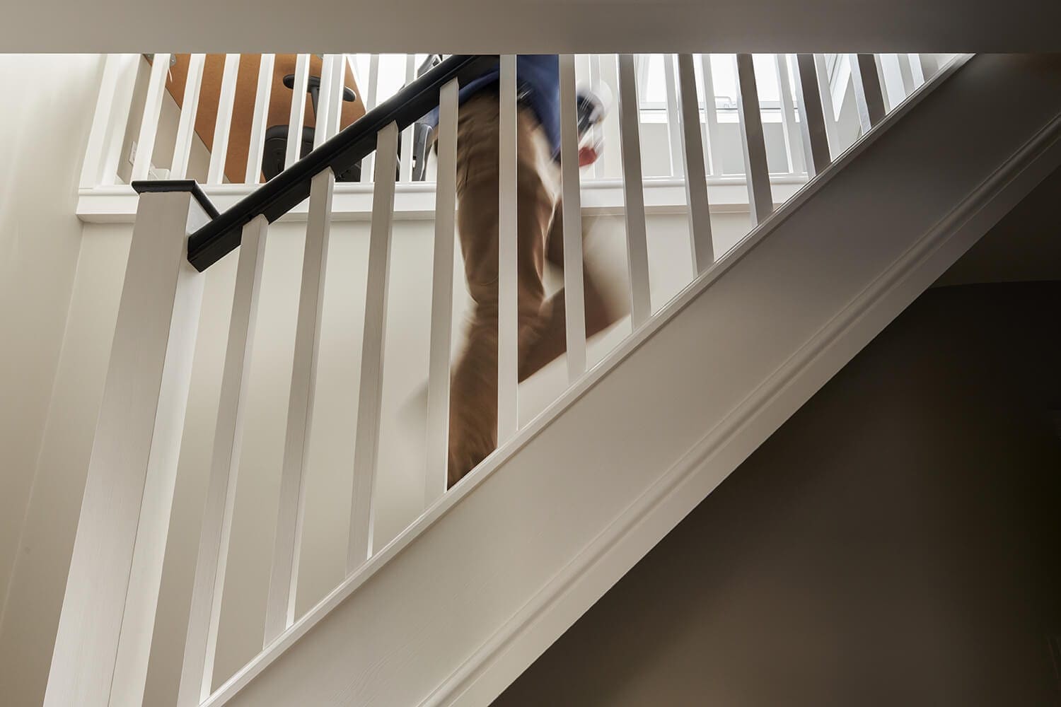 loft conversion staircase ideas man walking up staircase into loft conversion