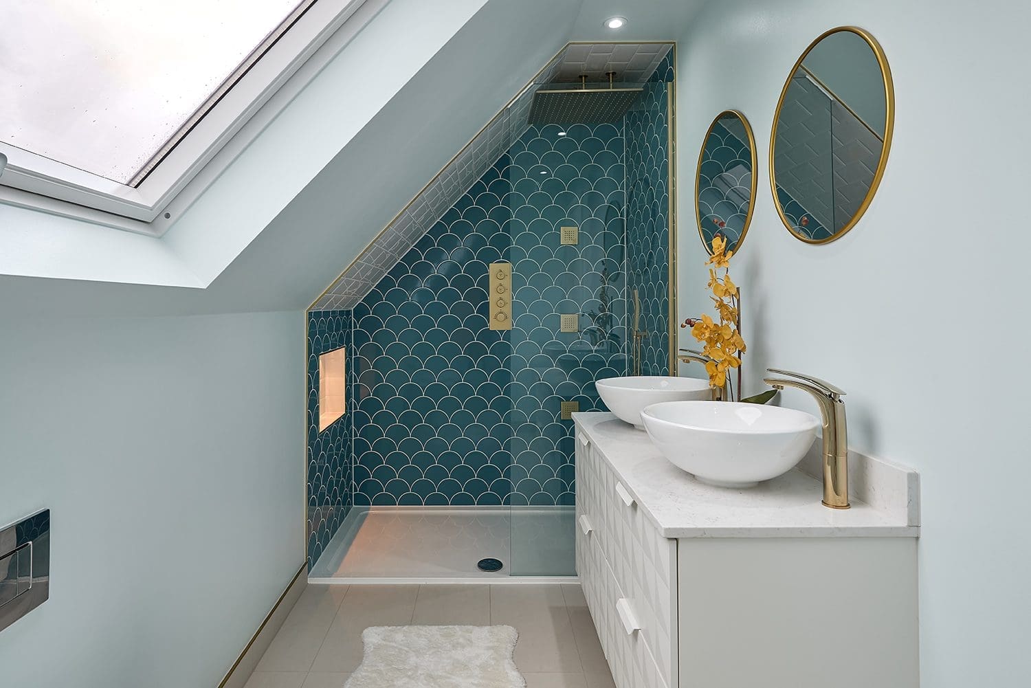 132-Gloucester-Road-4-copy blue tiled bathroom with waterfall shower in alcove of dormer loft