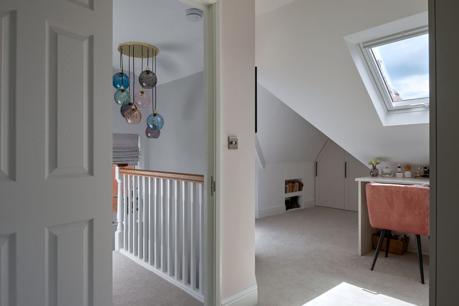 loft conversion hallway with bespoke wardrobe storage and roof windows