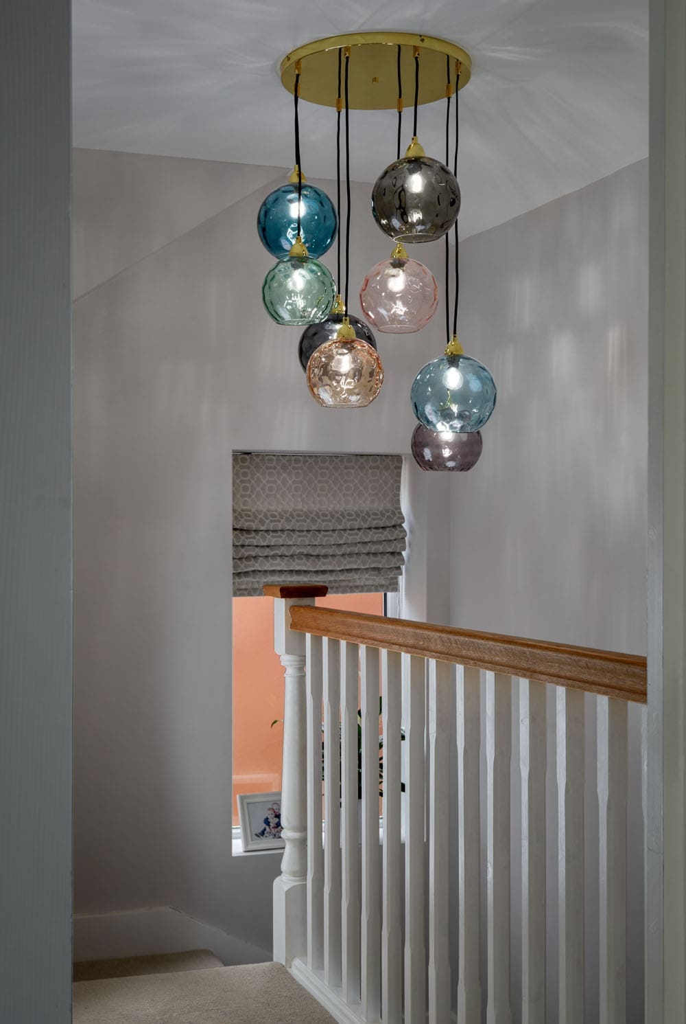 loft staircase for rear dormer with hanging statement art feature