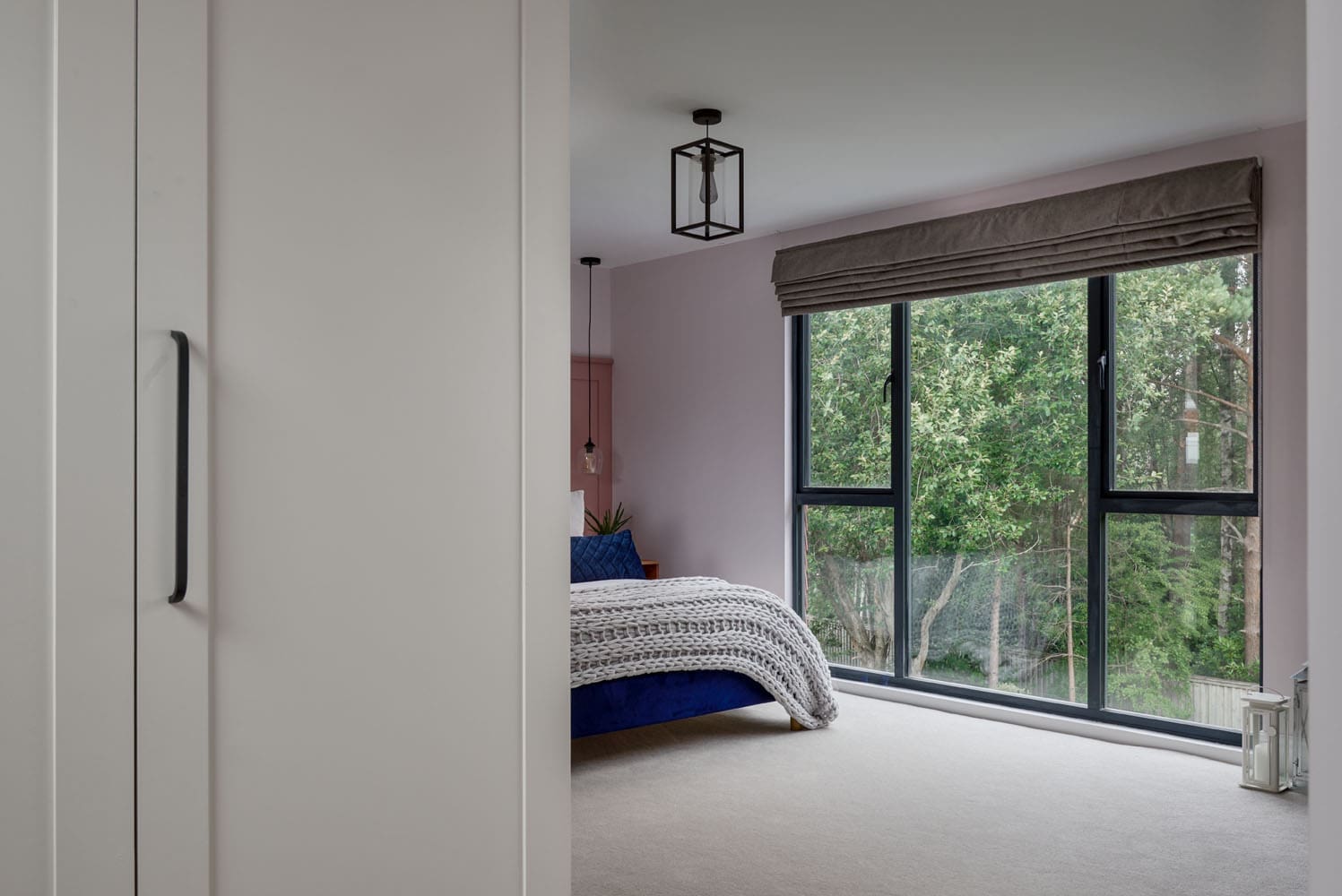 custom walk-in cream wardrobes adjacent to loft bedroom space