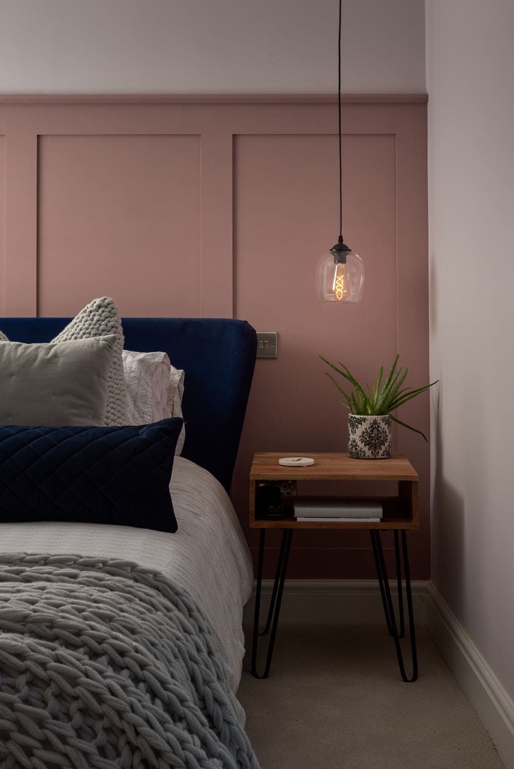 side of loft conversion bed and bedside table